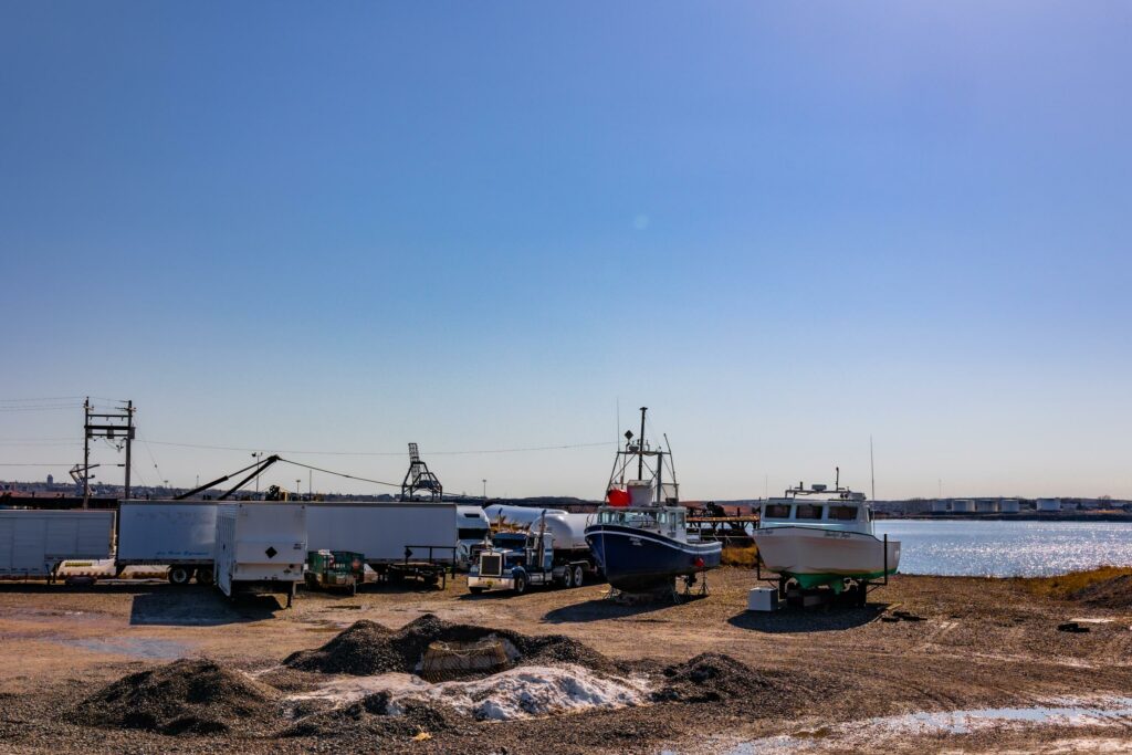 boats on land by the shore