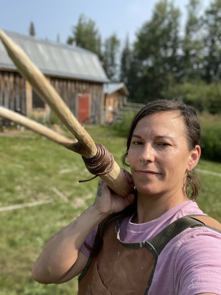 Person holding finished ricing pole.